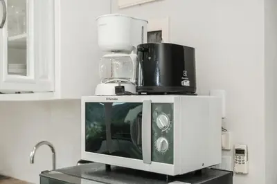 a appliance sitting on top of a counter in a kitchen at C196 Condo 1BR Sea View & 5 Min to Beach in Kata Beach