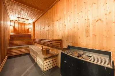 a sauna with wood paneled walls and a large tub at C197 Condo 1BR with Pool 3 Min Walk to Beach in Patong Beach