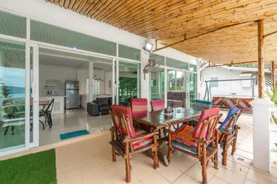 a dining room with a table and chairs at V199 Villa 4BR Relaxing with Best Views in Patong in Patong Beach