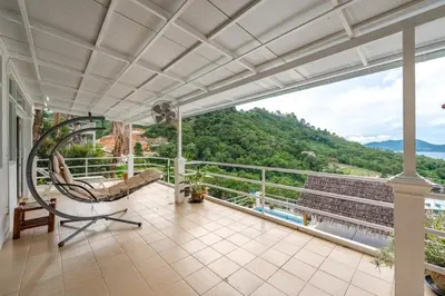 an indoor balcony with a view of the mountains at V199 Villa 4BR Relaxing with Best Views in Patong in Patong Beach