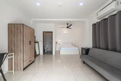 a living room with a couch and a bedroom at V199 Villa 4BR Relaxing with Best Views in Patong in Patong Beach