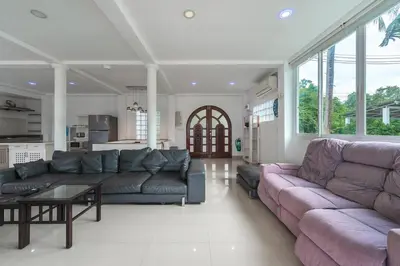 a living room with two couches and a table at V199 Villa 4BR Relaxing with Best Views in Patong in Patong Beach