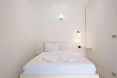 a white bed with two towels on top of it at V199 Villa 4BR Relaxing with Best Views in Patong in Patong Beach