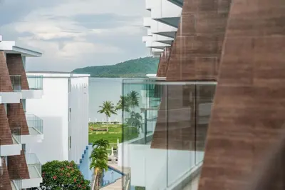 a view of the water from a building at C198 Oceanview Stay Gym, Pool & Walk to Beach in Rawai Beach