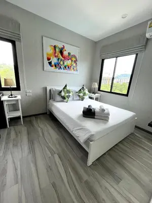 a bedroom with a large white bed and two windows at B9 Ватсап669З5В2I976 in Nai Yang Beach