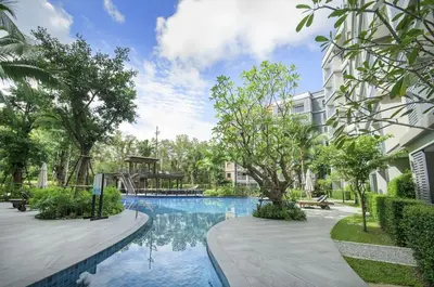 a swimming pool in front of a building at B9 Ватсап669З5В2I976 in Nai Yang Beach
