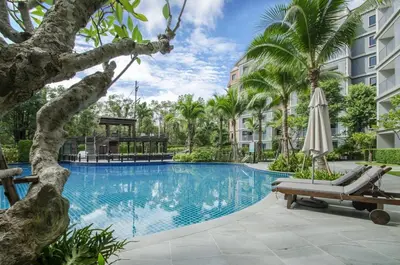 a swimming pool at a resort with an umbrella at B9 Ватсап669З5В2I976 in Nai Yang Beach