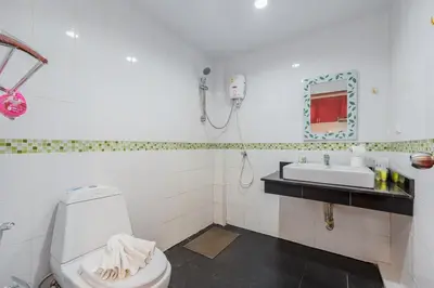 a bathroom with a toilet and a sink at C200 Relaxing 1BR Stay Walk to Nai Harn Beach in Rawai Beach