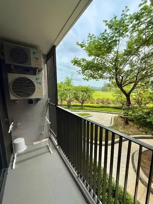 a balcony with a view of a tree at Laguna SkyPark by ShowProperty in Laguna Phuket