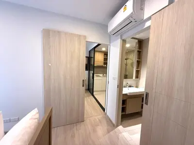 a large bathroom with a sink and a mirror at Laguna SkyPark by ShowProperty in Laguna Phuket