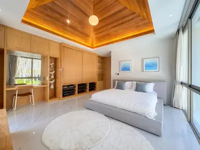 a bedroom with a bed and a wooden ceiling at LuxPride 4BR Spacious Pool Villa for Group and Families in Ban Pak Lak
