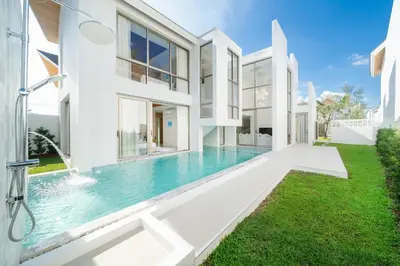 an exterior view of a house with a swimming pool at LuxPride 4BR Spacious Pool Villa for Group and Families in Ban Pak Lak
