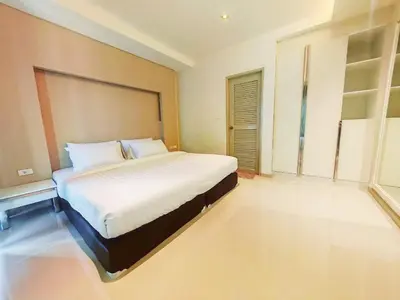 a bedroom with a large bed in a room at The Sleepy Place in Patong Beach