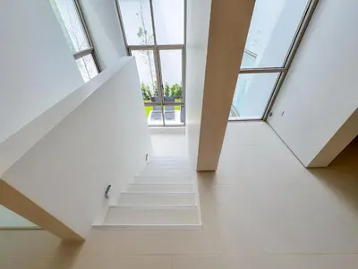 a staircase in a building with windows at Tropical Living in Private Pool 3BR Villa in New Residence LuxPride 4 L9 in Bang Tao Beach