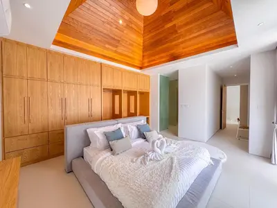 a bedroom with a bed with a wooden ceiling at Tropical Living in Private Pool 3BR Villa in New Residence LuxPride 4 L9 in Bang Tao Beach