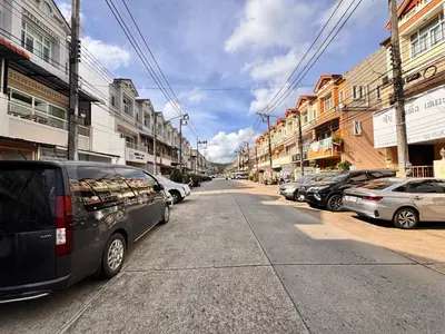 a street with cars parked on the side of the road at Tropikathu Guest House in Kathu
