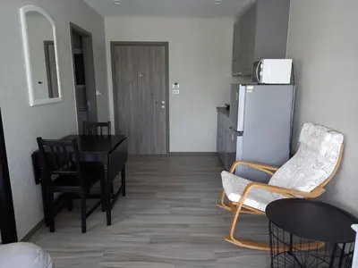 a kitchen and dining room with a table and a refrigerator at G16 Title Naiyang 36м2Ватсап669З5В2I976 in Nai Yang Beach