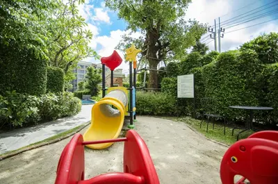a childrens playground with a slide in a park at G16 Title Naiyang 36м2Ватсап669З5В2I976 in Nai Yang Beach