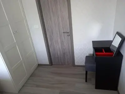 a room with a red chair and a door at G16 Title Naiyang 36м2Ватсап669З5В2I976 in Nai Yang Beach