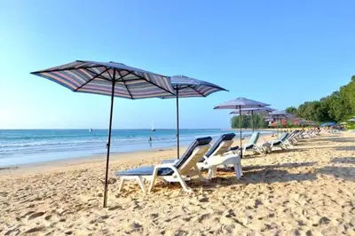 a row of chairs and umbrellas on a beach at G16 Title Naiyang 36м2Ватсап669З5В2I976 in Nai Yang Beach