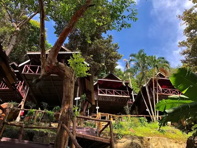 a resort with red roofs and trees at Phi Phi Ingphu Viewpoint Hotel in Phi Phi Don