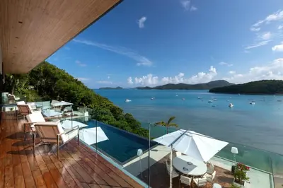 a view of the ocean from a house balcony at Cliff Top Residence in Phuket Town