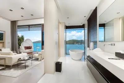 a bathroom with a view of the ocean at Cliff Top Residence in Phuket Town