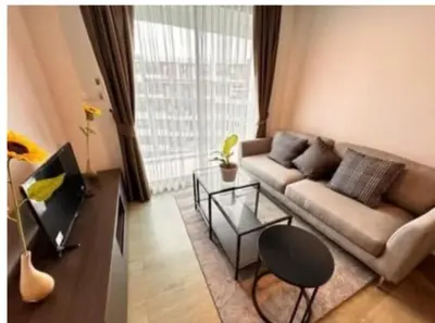 a living room with a couch and a table at Centrio 2 bed rooms in Phuket Town
