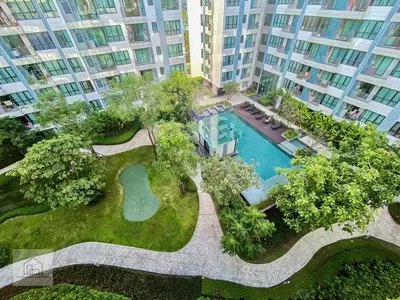 an aerial view of an apartment complex with a swimming pool at Centrio 2 bed rooms in Phuket Town