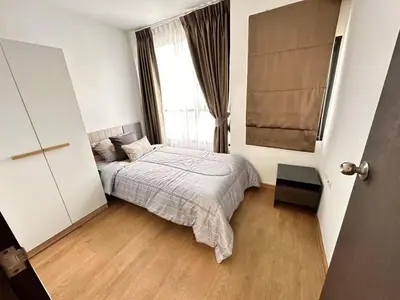a bedroom with a bed and a window at Centrio 2 bed rooms in Phuket Town