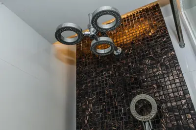 a shower with a black shower curtain and a metal grate at C202 Sun and Fun Kids Club 1BR 500m to Beach in Kata Beach