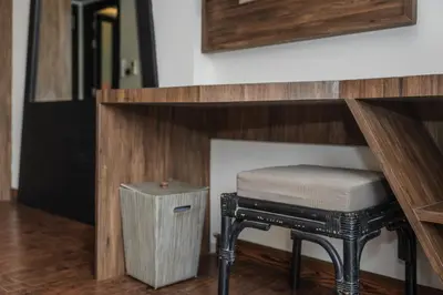 a stool sitting under a counter with a table at C202 Sun and Fun Kids Club 1BR 500m to Beach in Kata Beach