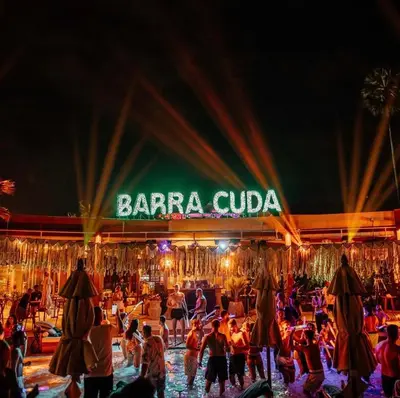 a crowd of people standing in front of a baraja club at The Kris Luxury in Patong Beach