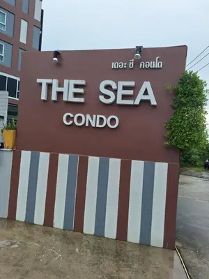 a sign for the sea combo in front of a building at The Sea Condo Ao Nang Apartment Relax with Sea View in Ban Khlong Haeng