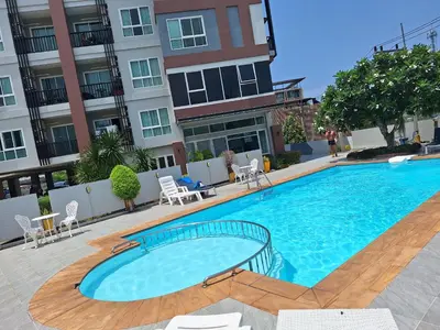 a swimming pool at a apartment complex at The Sea Condo Ao Nang Apartment Relax with Sea View in Ban Khlong Haeng