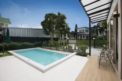 a swimming pool in the middle of a yard at Your Tropical Island Home - New & Modern 2BR Pool Villa Seamate in Chalong