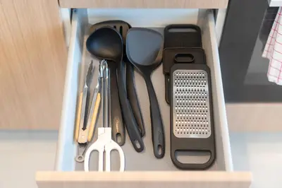 a drawer filled with utensils in a cabinet at Villa Chandlers - Goldena Twin in Kamala Beach