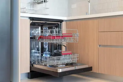 a dishwasher in a kitchen with red dishes in it at Villa Chandlers - Goldena Twin in Kamala Beach
