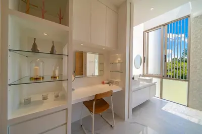 a bathroom with a vanity and a sink and a window at The Residence Tropical 3BR Villa with Private Pool in Ban Pak Lak