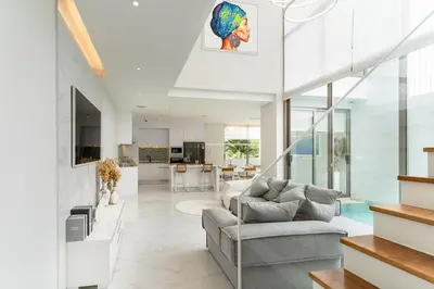 a living room with a couch and a table at The Residence Tropical 3BR Villa with Private Pool in Ban Pak Lak