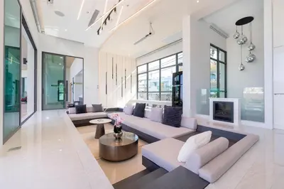 a living room with a couch and a table at Elite Villa Patong Phuket in Patong Beach