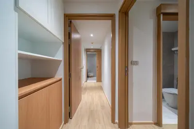 a hallway of a house with a staircase and a bathroom at Apartment at Laguna Beachside by Lofty in Bang Tao Beach