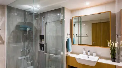 a bathroom with a glass shower and a sink at Beachside Residence 4 floor, Seaside, 250m to the beach in Bang Tao Beach