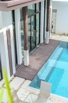 a swimming pool in the middle of a building at Wings Elegant 2BR Villa Bang Tao Beach in Laguna Phuket