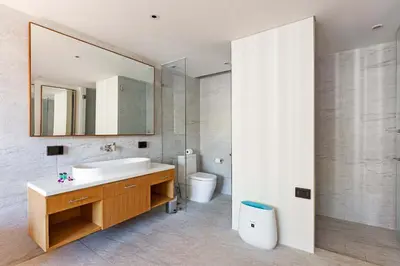 a bathroom with a sink and a mirror and a toilet at Ocean View 3BR Apartment with Rooftop Terrace, Sapphire Bay 8-19 Residence in Patong Beach