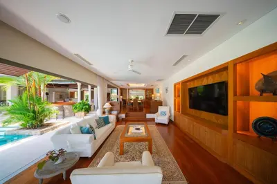 a living room with a couch and a table at 4BR Lakeshore Pool Villa in Laguna Bangtao in Bang Tao Beach