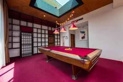 a pool table in the middle of a room at Villa Fam with Private Pool Near Nai Harn Beach in Rawai Beach