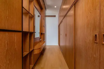 a hallway with wooden walls and wooden floors and a door at Villa Fam with Private Pool Near Nai Harn Beach in Rawai Beach