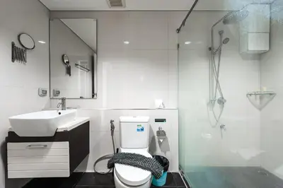 a bathroom with a toilet and a sink and a shower at C205 4BR Pool, Mountain Views & Prime Location in Kamala Beach