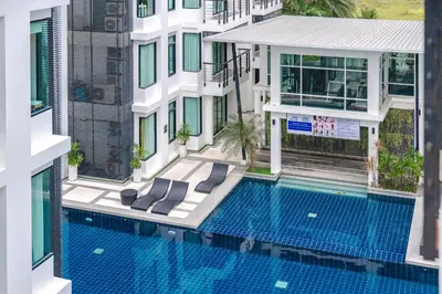 an aerial view of a building with a swimming pool at C205 4BR Pool, Mountain Views & Prime Location in Kamala Beach